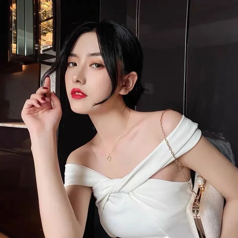 Collier Croix Rotatif