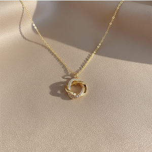 Collier Croix Rotatif